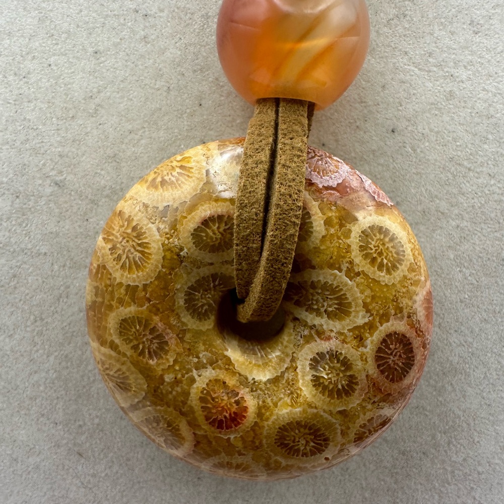 Brown and Tan Coral Fossil Donut Pendant Necklace on Brown Faux Suede - Picture 4 of 13